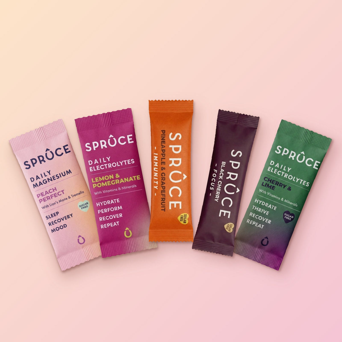 The five Spruce sachets in the Mega Bundle fanned out: Peach Perfect magnesium, Lemon & Pomegranate, Pineapple & Grapefruit, Black Cherry Focus and Cherry & Lime